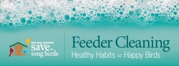 A turquoise graphic covered with soap bubbles reads, &ldquo;Feeder Cleaning: Healthy Habits = Happy Birds,&rdquo; with the Wild Birds Unlimited Save the Song Birds logo.