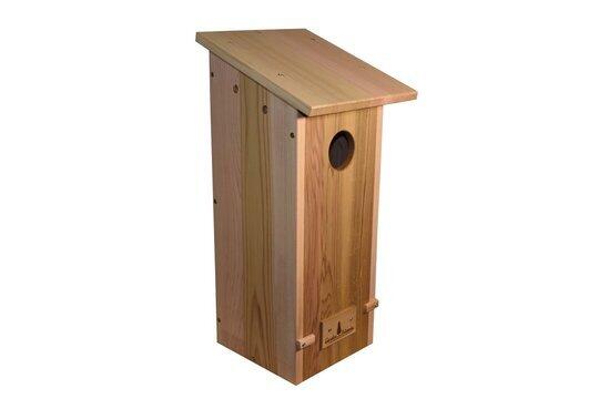 Tall wooden Northern Flicker nest box with a sloped roof, round entrance hole, and front-opening panel.