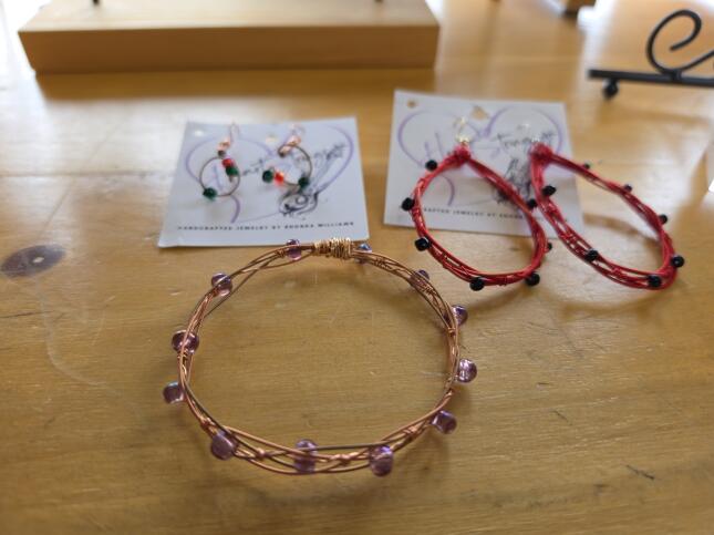 Handcrafted Hart Strings earrings and bracelets made from colorful guitar strings and beads by Colorado Springs maker Rhonda Williams.